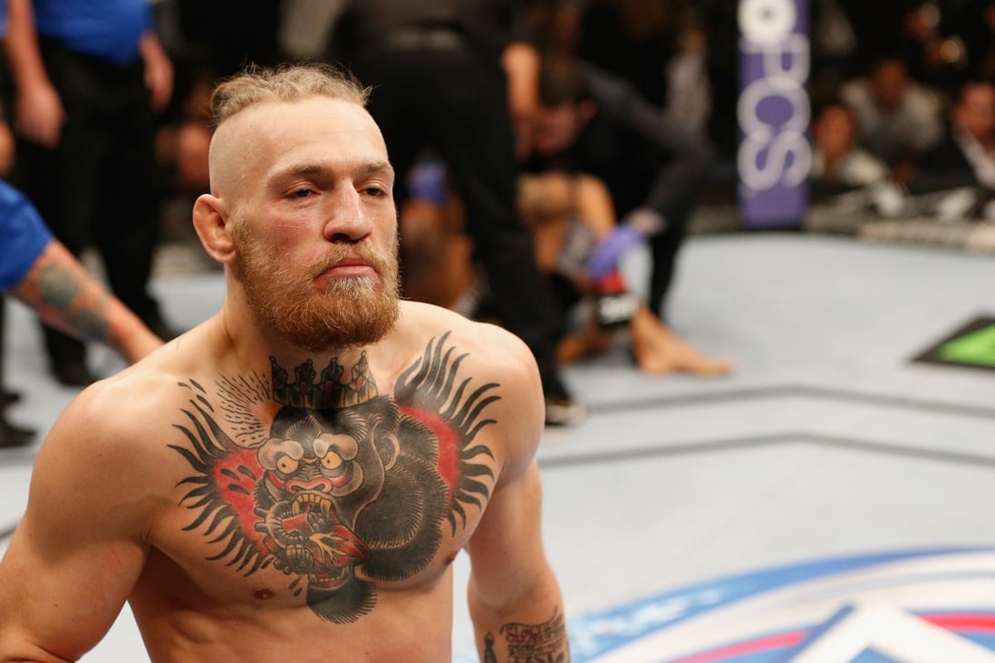 Conor McGregor walks off after his first-round TKO win over Dustin Poirier in their featherweight fight at UFC 178. Photo: Josh Hedges/Zuffa LLC via Getty Images
