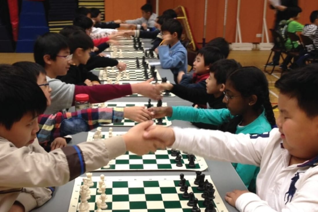 Young players shake hands before the start of a chess tournament in Hong Kong. Photos: ActiveKids