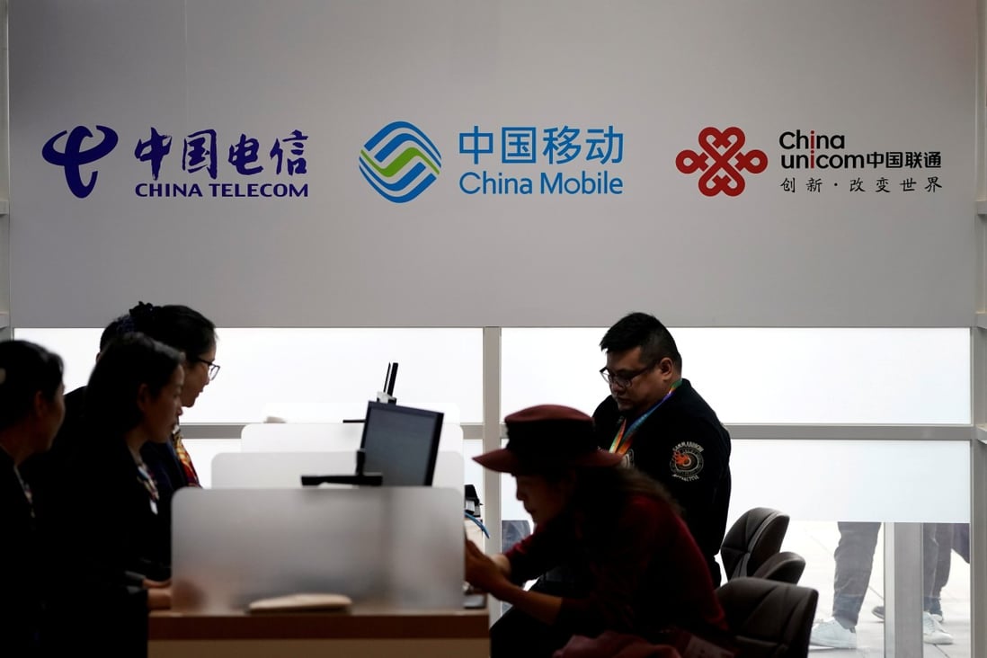 Logos of China Telecom, China Mobile and China Unicom seen during the China International Import Expo (CIIE) at the National Exhibition and Convention Center in Shanghai on November 5, 2018. Photo: Reuters