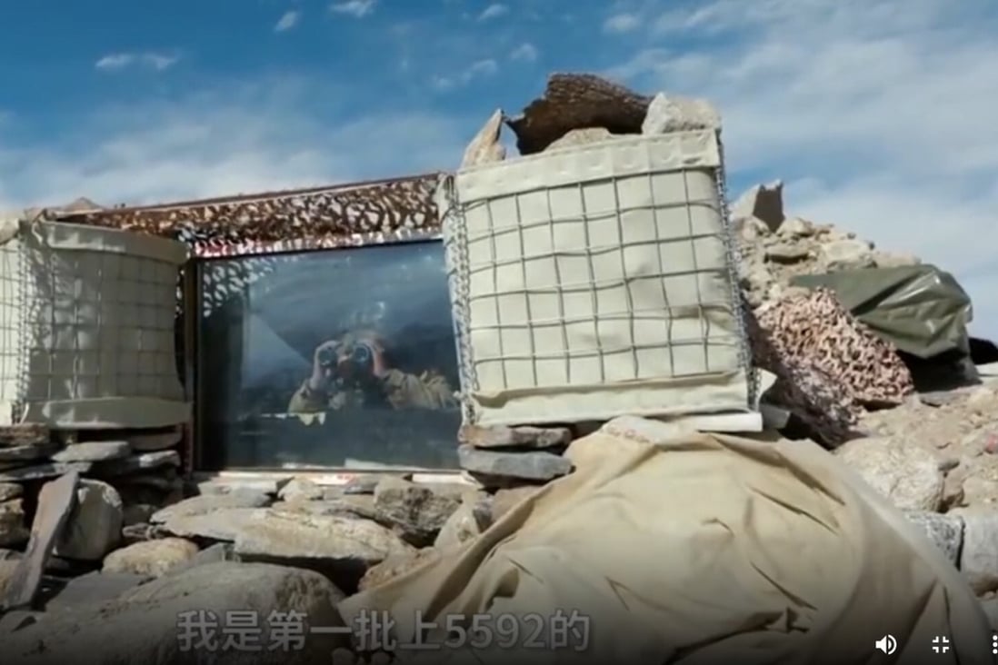 A PLA soldier keeps watch from the improved 5592 observation post. Photo: CCTV