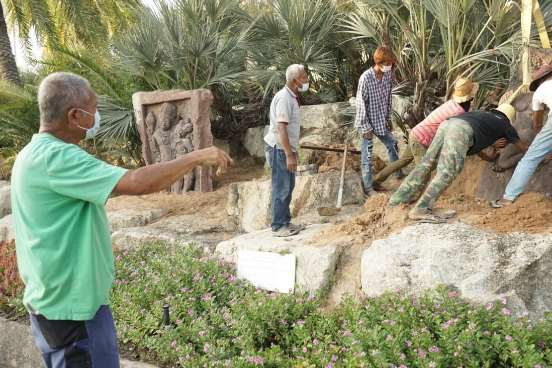 Kampon Tansacha, the owner of Noongnooch Tropical Garden, directs his landscaping crew in making refinements to the park. Photo: Vijitra Duangdee