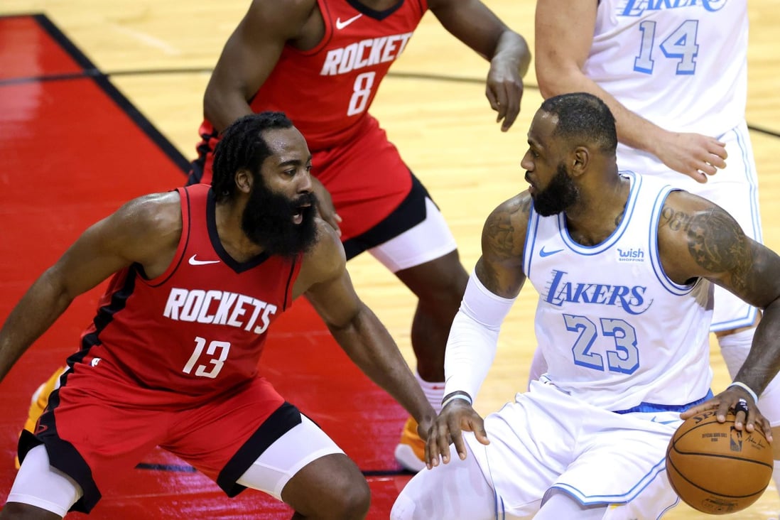 LeBron James, of the Los Angeles Lakers, battles with James Harden, of the Houston Rockets, in an NBA game. Photo: AFP