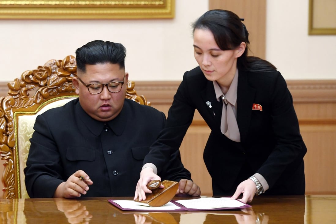 Kim Jong-un, with his sister Kim Yo-jong (right), signs a joint statement following a summit with South Korean President Moon Jae-in on September 19, 2018. File Photo: AP