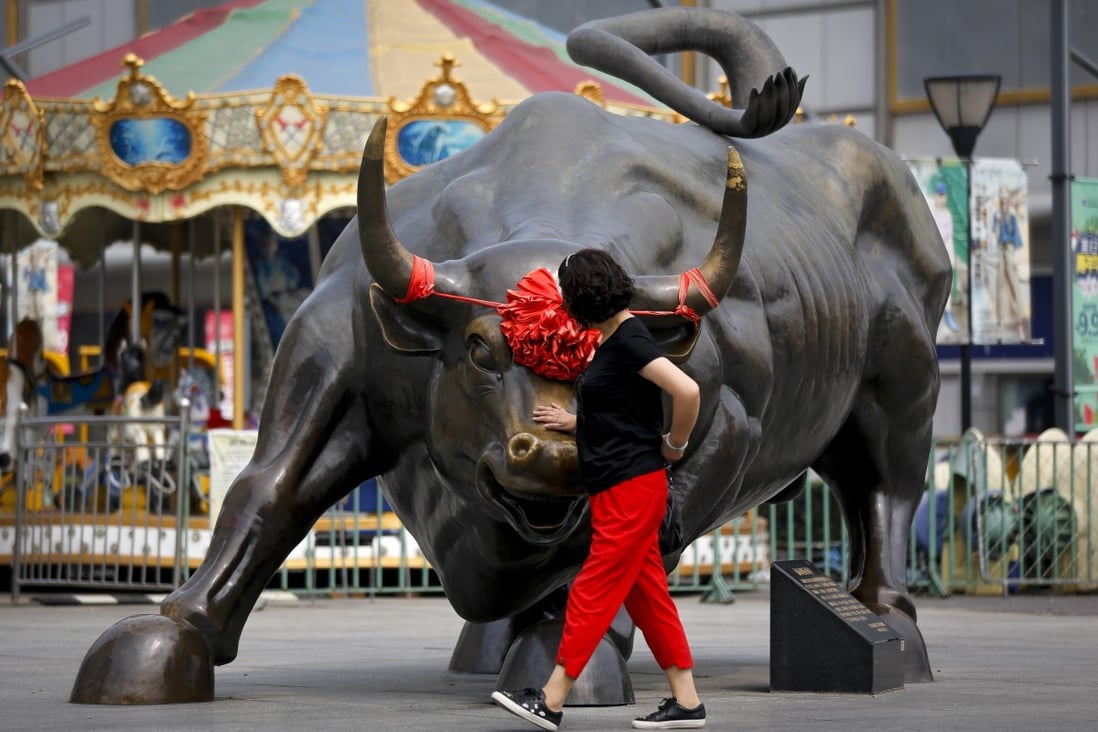 A bull sculpture located outside a retail and wholesale clothing mall in Beijing. Stocks in mainland China and Hong Kong retreated after a powerful start to the new year. Photo: AP