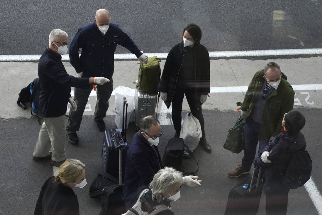 Members of a WHO team arrive in Wuhan in central China's Hubei province on Thursday. Photo: AP