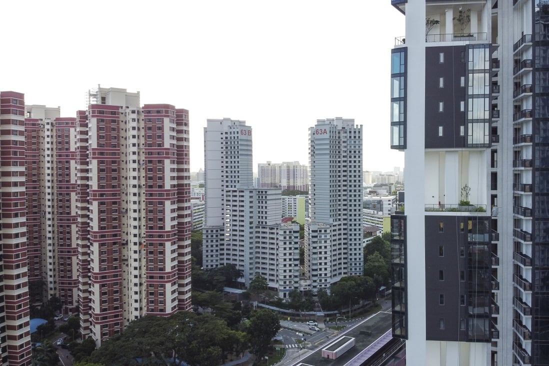 Public housing units by the Housing and Development Board, left, and private residential buildings under construction in Singapore. Photo: Roy Issa