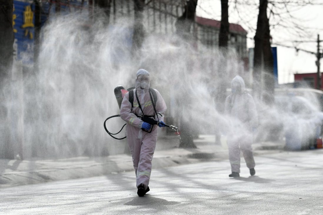 Workers spray disinfectant in the Gaocheng district of Shijiazhuang, the capital of Hebei province. Photo: AFP