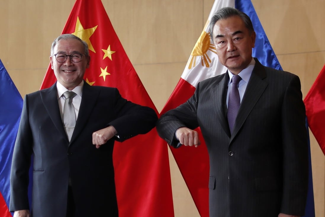 Philippine Foreign Affairs Secretary Teodoro Locsin Jnr with Chinese Foreign Minister Wang Yi in Manila. Photo: AP