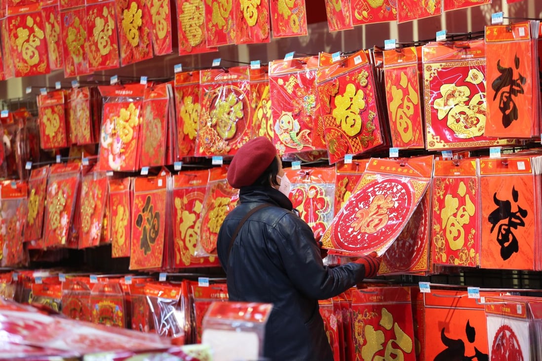 Chinese citizens are being encouraged not to travel for the Lunar New Year holiday because of concerns the usual mass migration to the countryside and back will spread Covid-19. Photo: Getty Images
