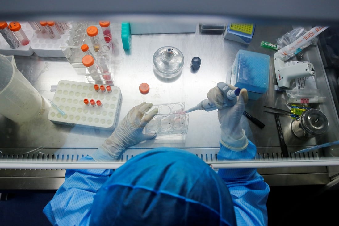 A technician works with genome samples at a lab of the biotech company in Beijing. Photo: Reuters