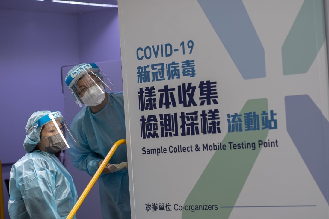 Health workers stand in a coronavirus mobile testing station in Hong Kong. Photo: EPA-EFE