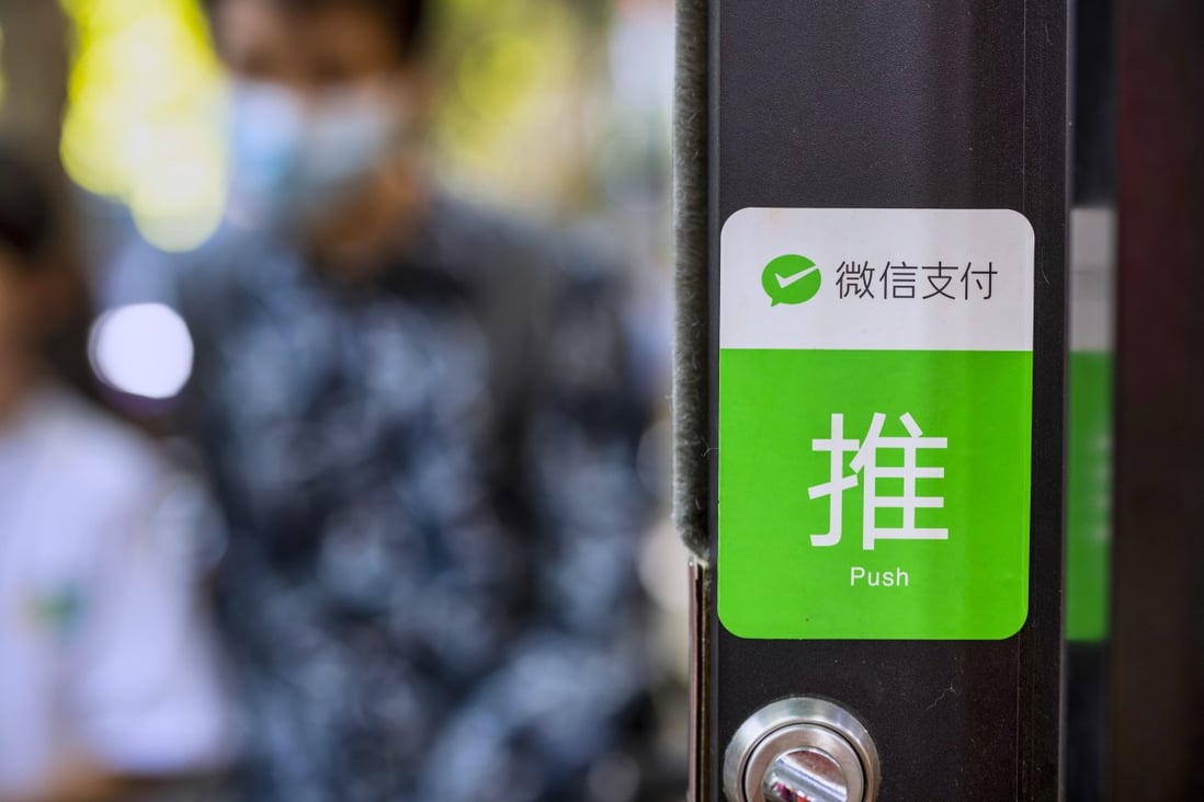 A sticker at a Shanghai store lets customers know it accepts payments via WeChat. Photo: EPA-EFE