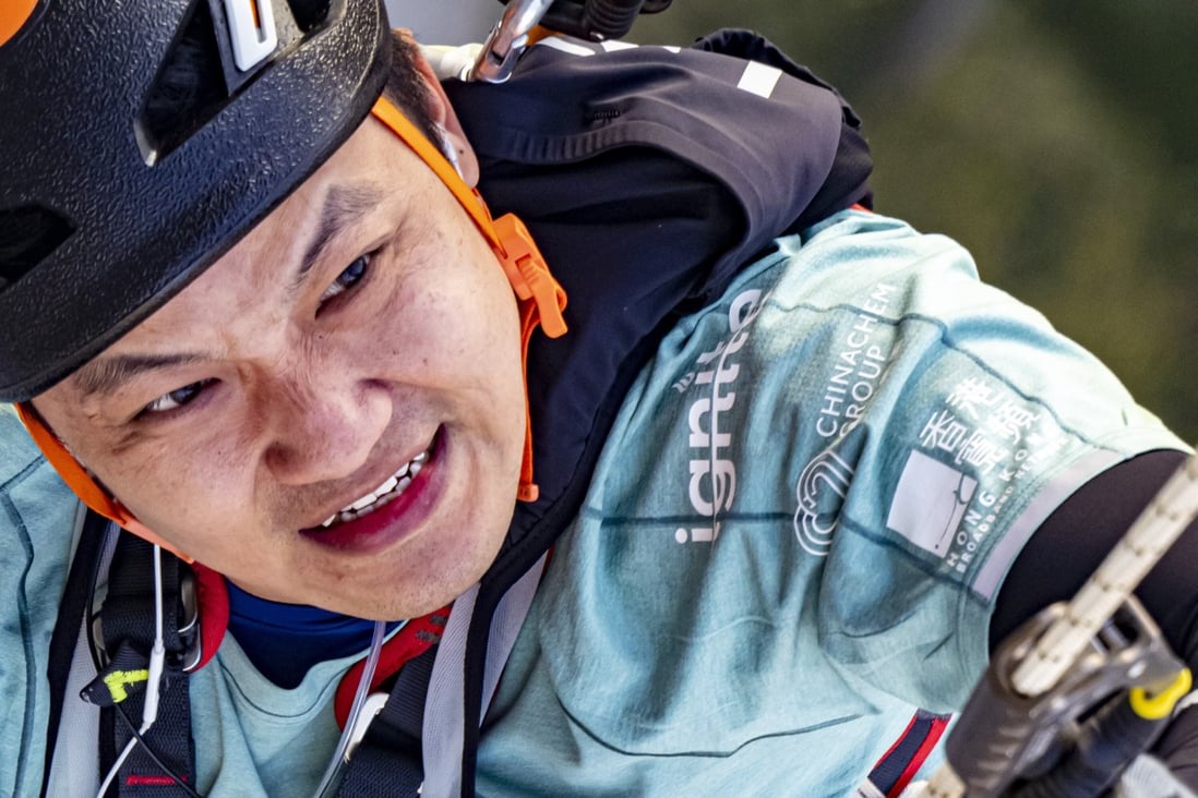 Hong Kong wheelchair climber Lai Chi-wai hauls himself up Nina Tower in Tsuen Wan. Photos: Handout