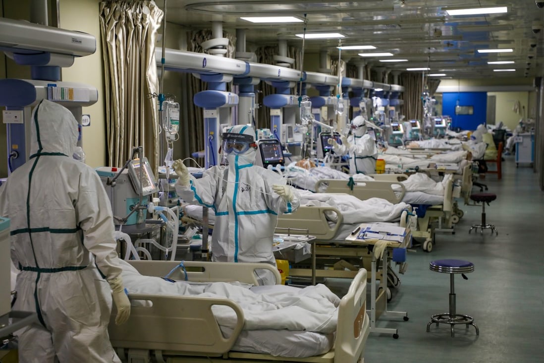 Medical workers attend to Covid-19 patients at a hospital in Wuhan in February. Beijing has for months defended its initial response to the virus. Photo: Reuters