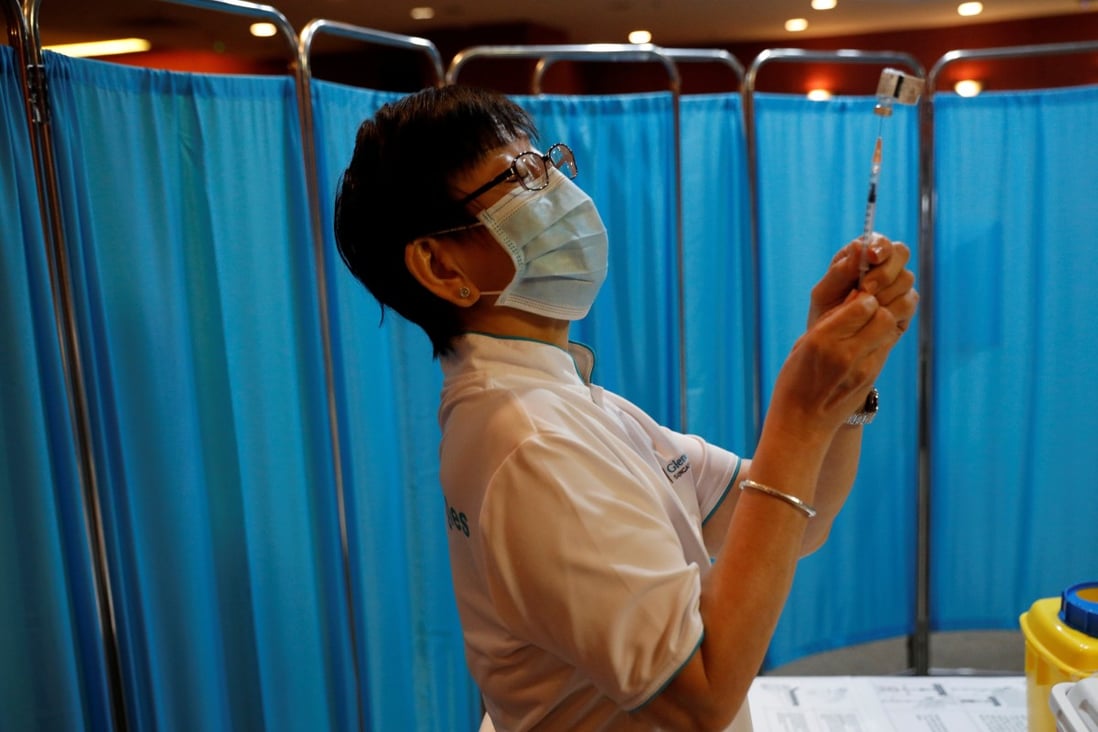 A nurse prepares to vaccinate health care workers at Gleneagles hospital in Singapore. Photo: Reuters