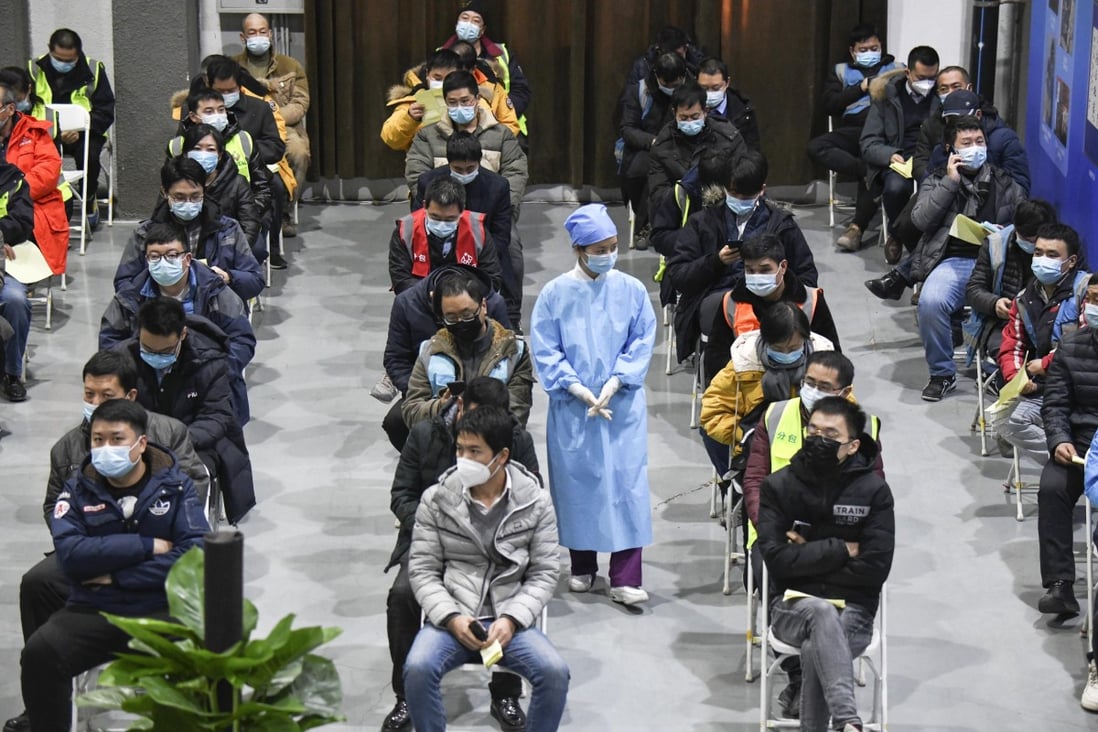 Coronavirus vaccine recipients in Beijing wait for 30 minutes to see if they have any adverse reactions. Photo: Kyodo