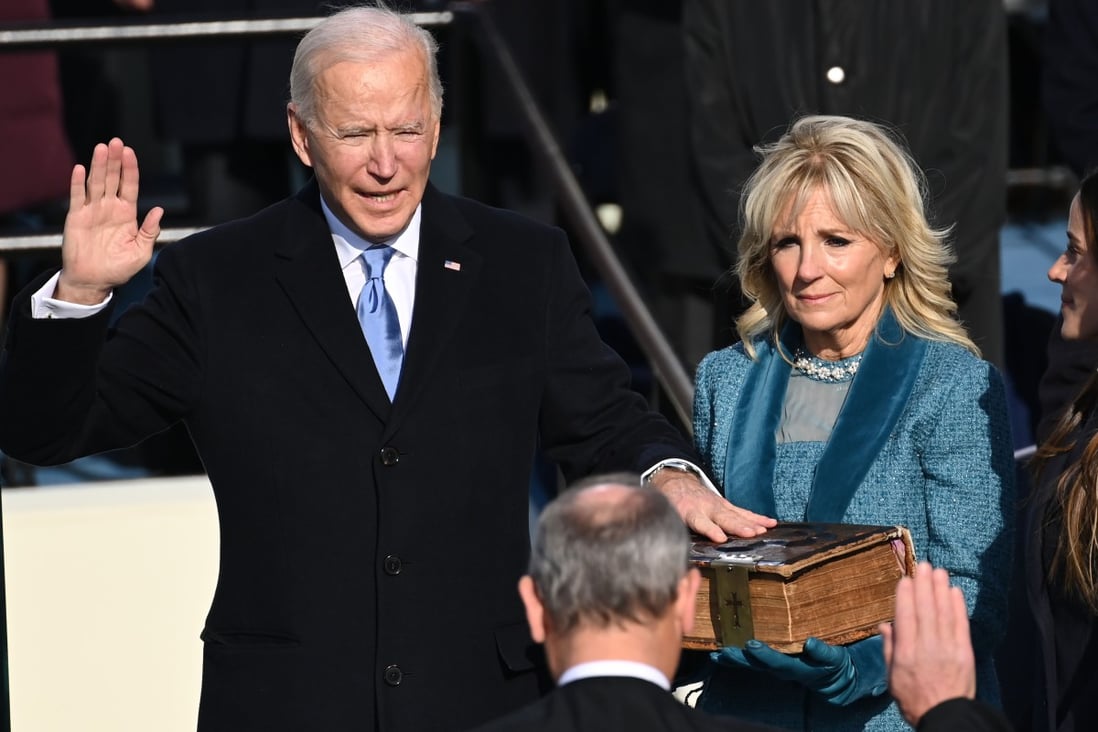 Joe Biden is sworn in as the 46th US president of the United States on Wednesday at the Capitol in Washington. Biden’s wife, Jill Biden, holds the Bible he is swearing on as Chief Justice John Roberts of the US Supreme Court administers the oath of office. Photo: AFP