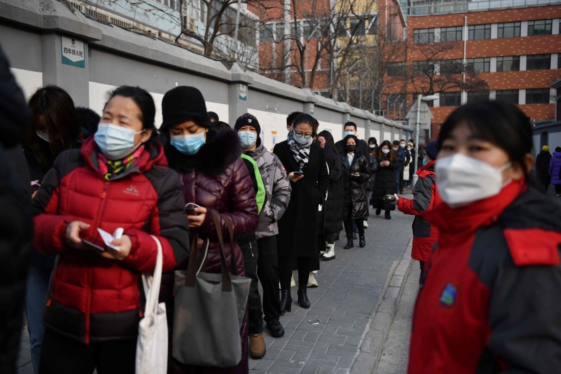 People line up to be tested for the coronavirus in Beijing on Friday. Photo: AFP