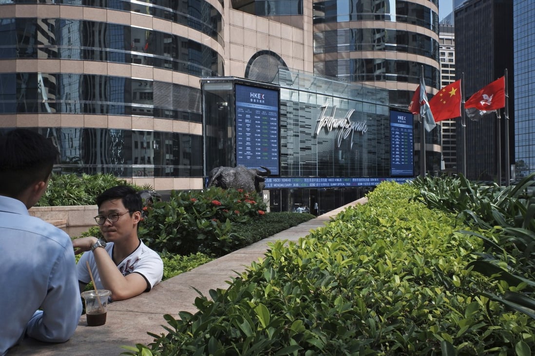 A screen showing stock prices near the Exchange Square in Central, Hong Kong. The Hang Seng Index has struggled to tackle the 30,000 hurdle after several attempts this week. Photo: Nora Tam