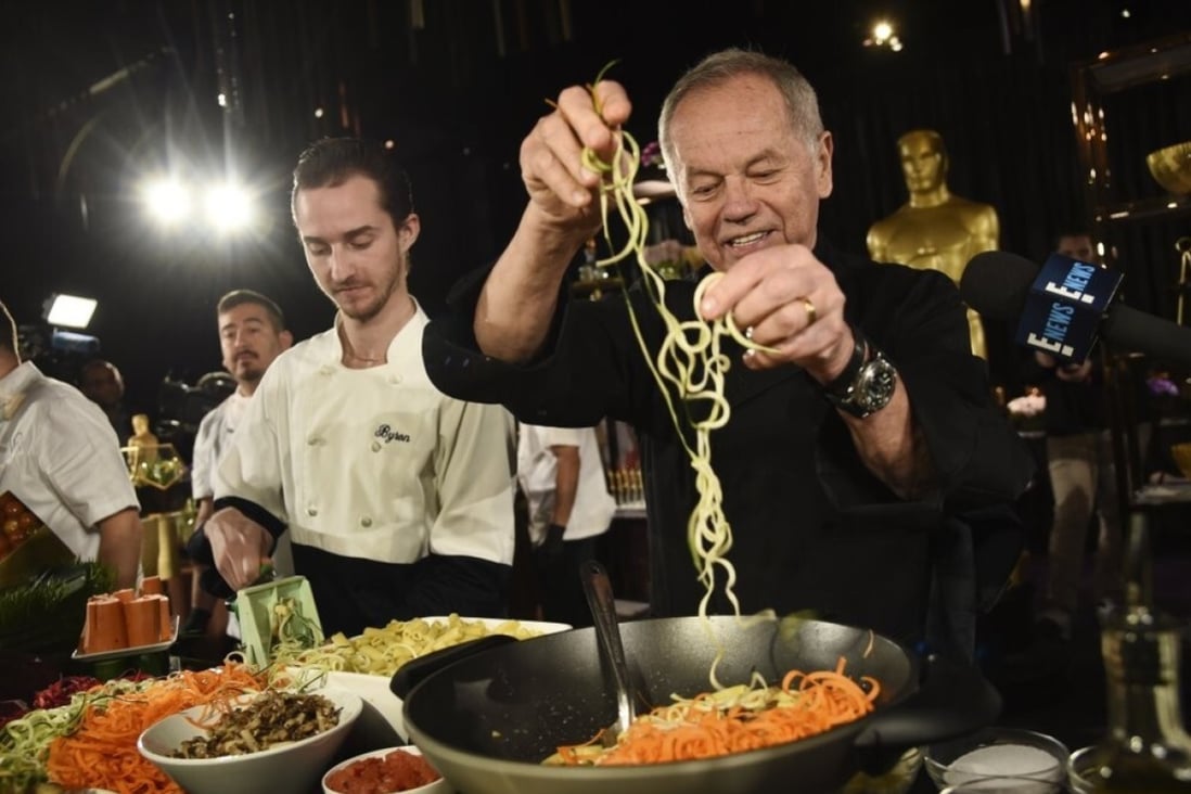Chef Wolfgang Puck and his son Byron make a pasta dish at the Governors Ball Press Preview for the 92nd Academy Awards in Los Angeles on January 31, 2020. Photo: AP Photo
