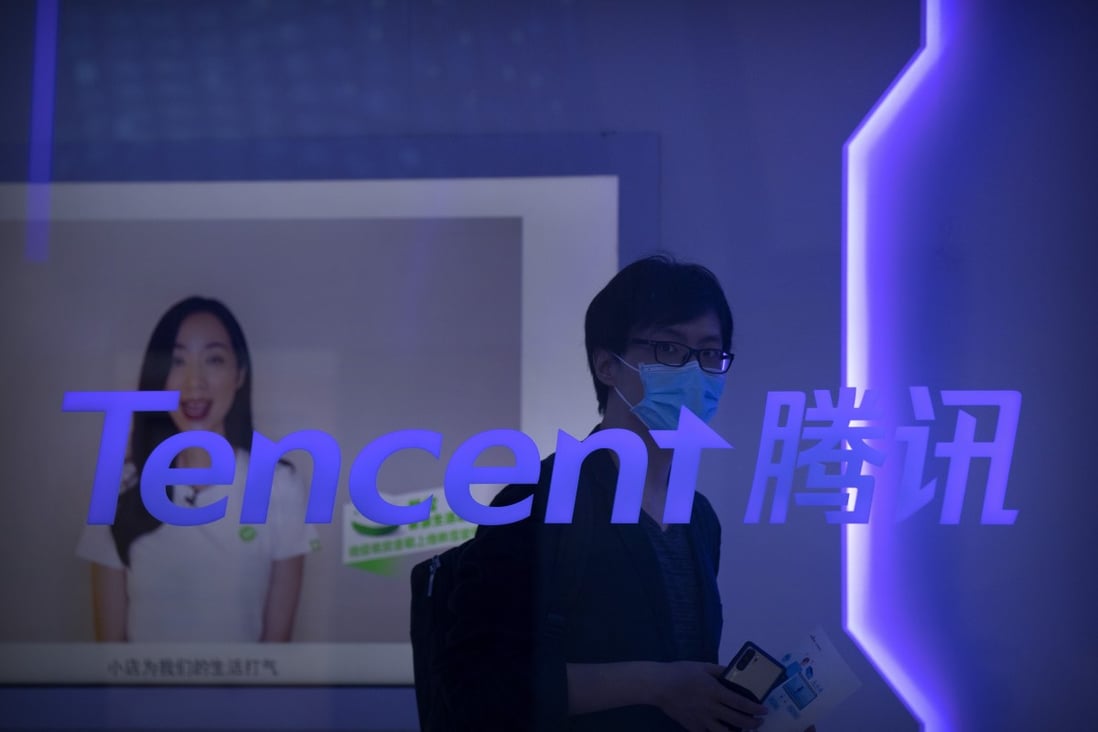 A visitor walks past a logo for Chinese technology firm Tencent at their display at the China International Fair for Trade in Services (CIFTIS) in Beijing on September 5, 2020. Photo: AP