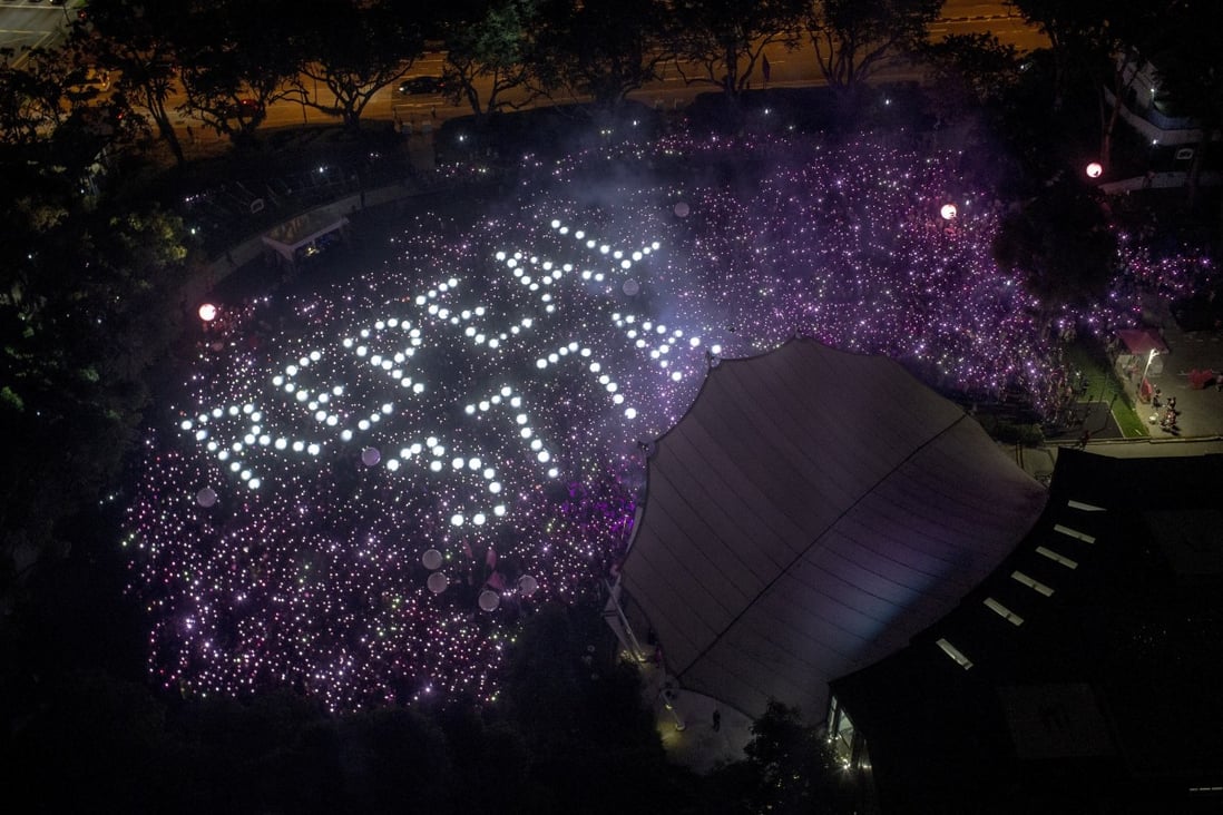 People at a Singapore gay pride gathering form the words ‘Repeal 377A’ on 29 June 2019. Photo: EPA-EFE