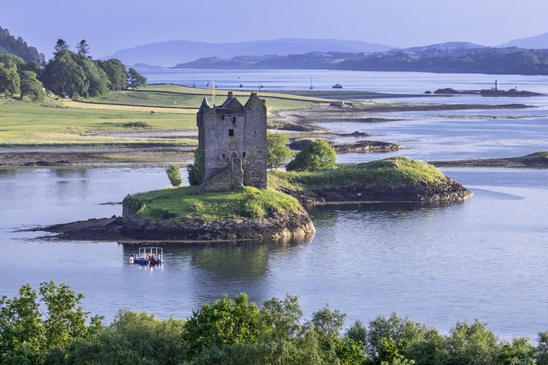 Castle Stalker in Loch Laich, Argyll, Scotland. VisitScotland has become the first national tourist board to declare a climate emergency, by joining the global Tourism Declares initiative. Photo: Getty Images