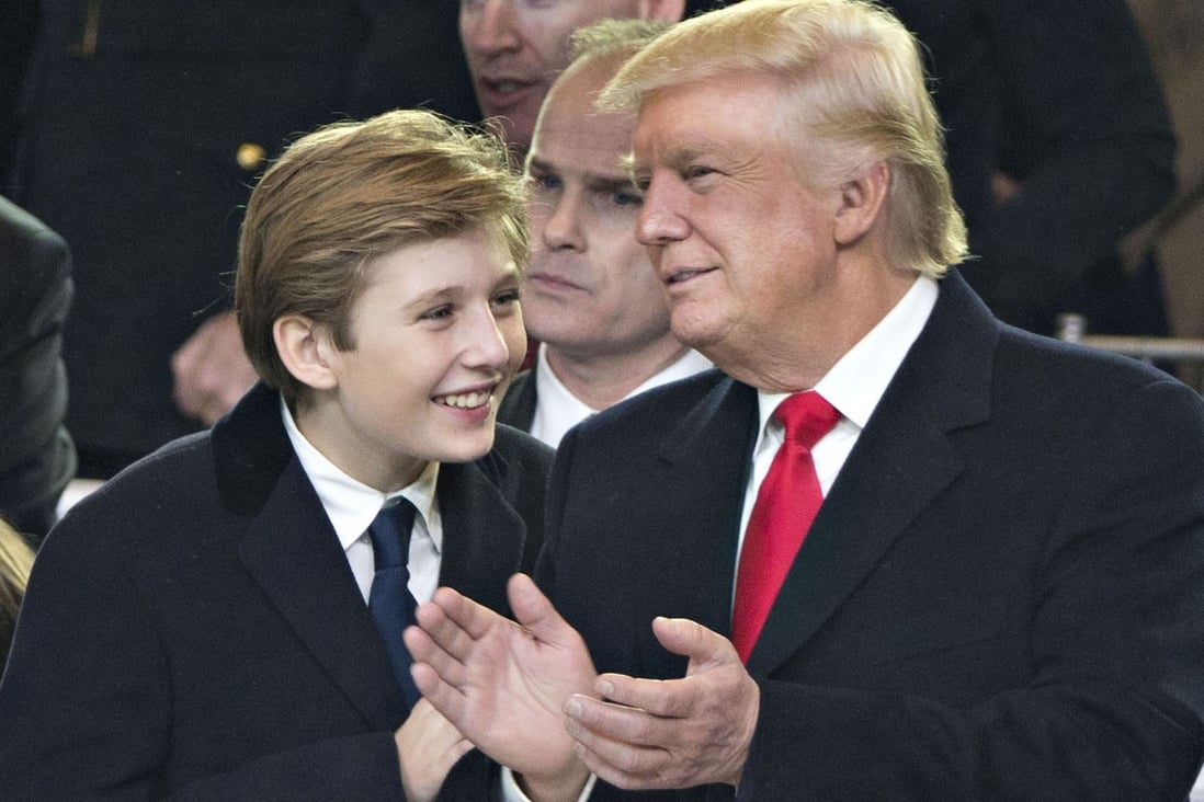 Former US president Donald Trump with his son Barron in the presidential review stand outside the White House during the 58th presidential inauguration parade in Washington on January 20, 2017. Photo: Bloomberg