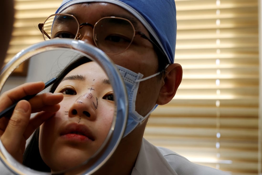 A woman consults with a plastic surgeon before undergoing a nose operation in Seoul. Photo: Reuters