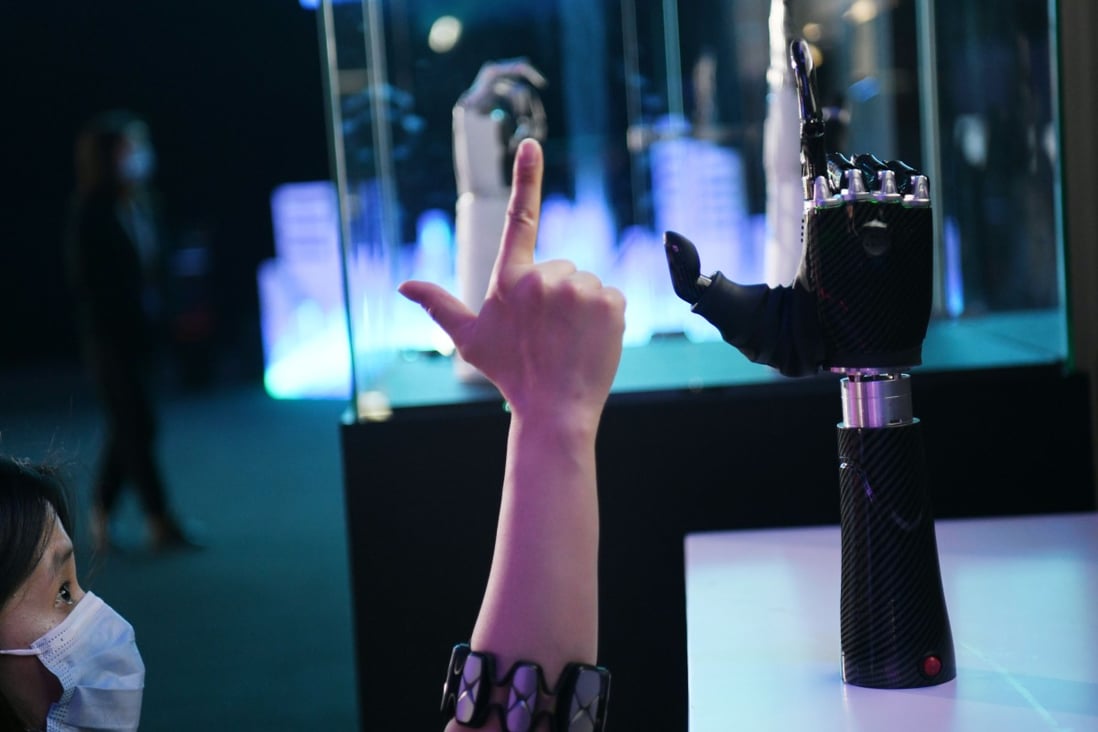 An employee demonstrates a wearable AI-powered bionic hand at the JD Global Technology Discovery Conference in Beijing, Nov. 25, 2020. China must mobilise the nation’s private businesses to reduce reliance on foreign technologies, says a top policy adviser. Photo: Xinhua