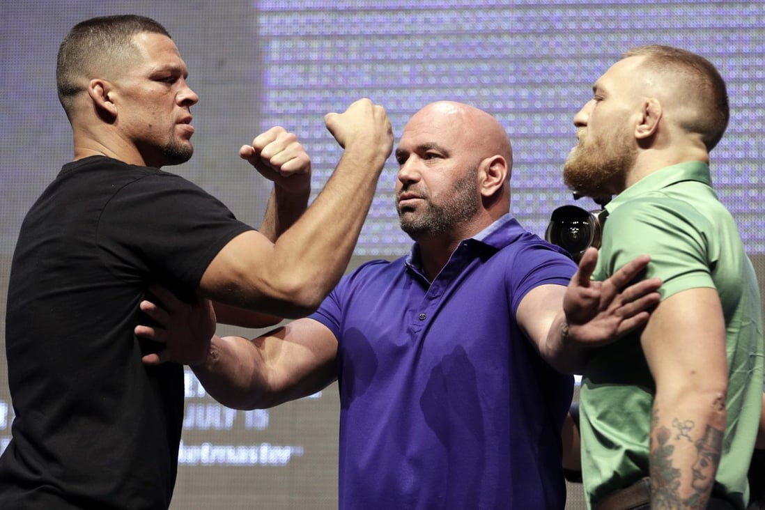 Nate Diaz and Conor McGregor are separated by UFC president Dana White during a UFC 202 press conference in Las Vegas in 2016. Photo: AP