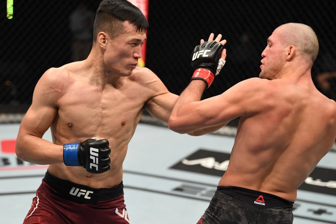 ‘The Korean Zombie’ Jung Chan-sung punches Brian Ortega in their featherweight bout on October 18, 2020 in Abu Dhabi. Photo: Josh Hedges/Zuffa LLC via Getty Images
