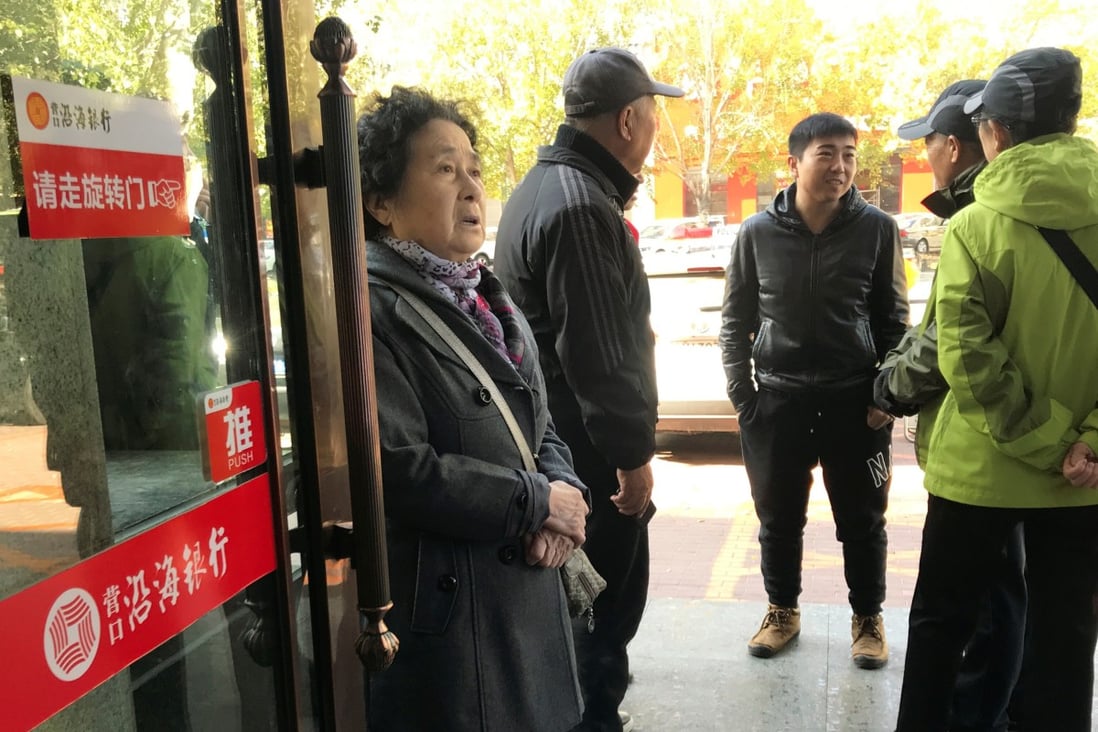 Elderly depositors seek information about the safety of their savings at a branch of Yingkou Costal Bank in Yingkou, Liaoning province, in 2019, when a run on the bank took place. Photo: Reuters