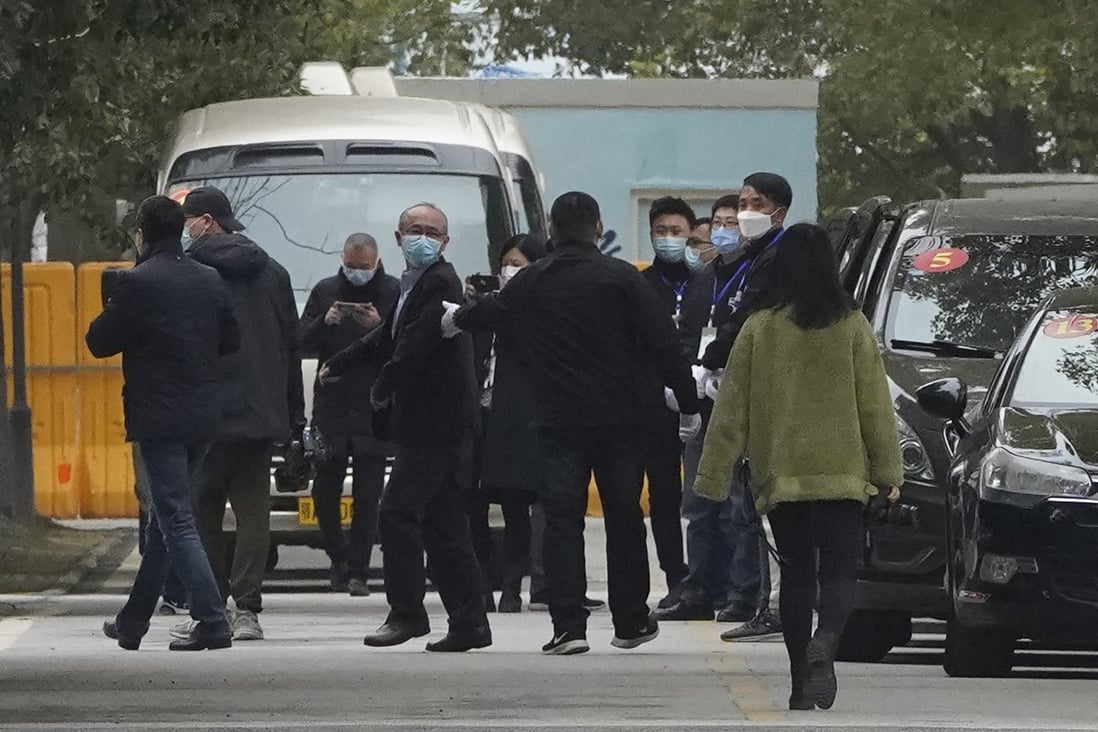 Members of the World Health Organization team depart from the Wuhan Jinyintan Hospital. Photo: AP