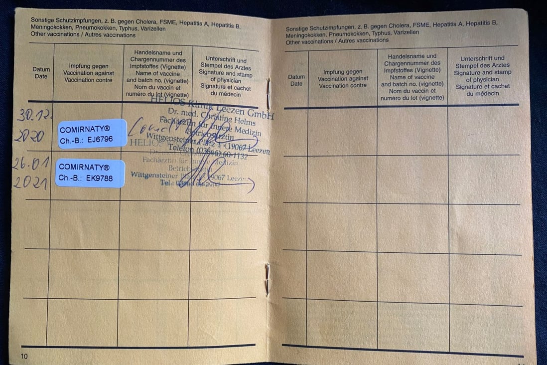 Stickers in a vaccination certificate confirm the receipt of two doses of the Pfizer-BioNTech Covid-19 vaccine in Zickhusen, Germany. Photo: Reuters