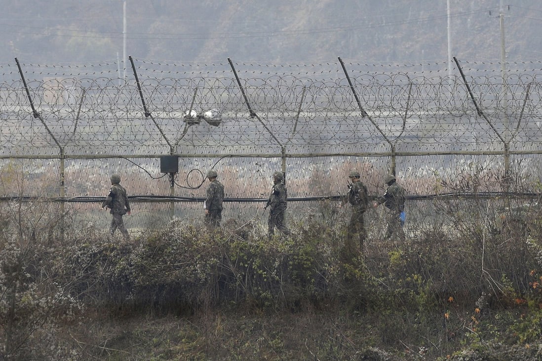 South Korean army soldiers patrol a fence in Paju, South Korea, near the border with North Korea. File photo: AP