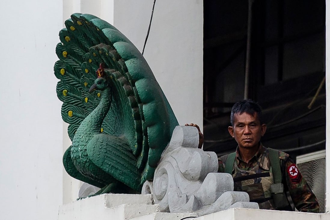 A soldier stands guard in City Hall in Yangon on February 1 after Myanmar's military seized power in a bloodless coup. Photo: AFP