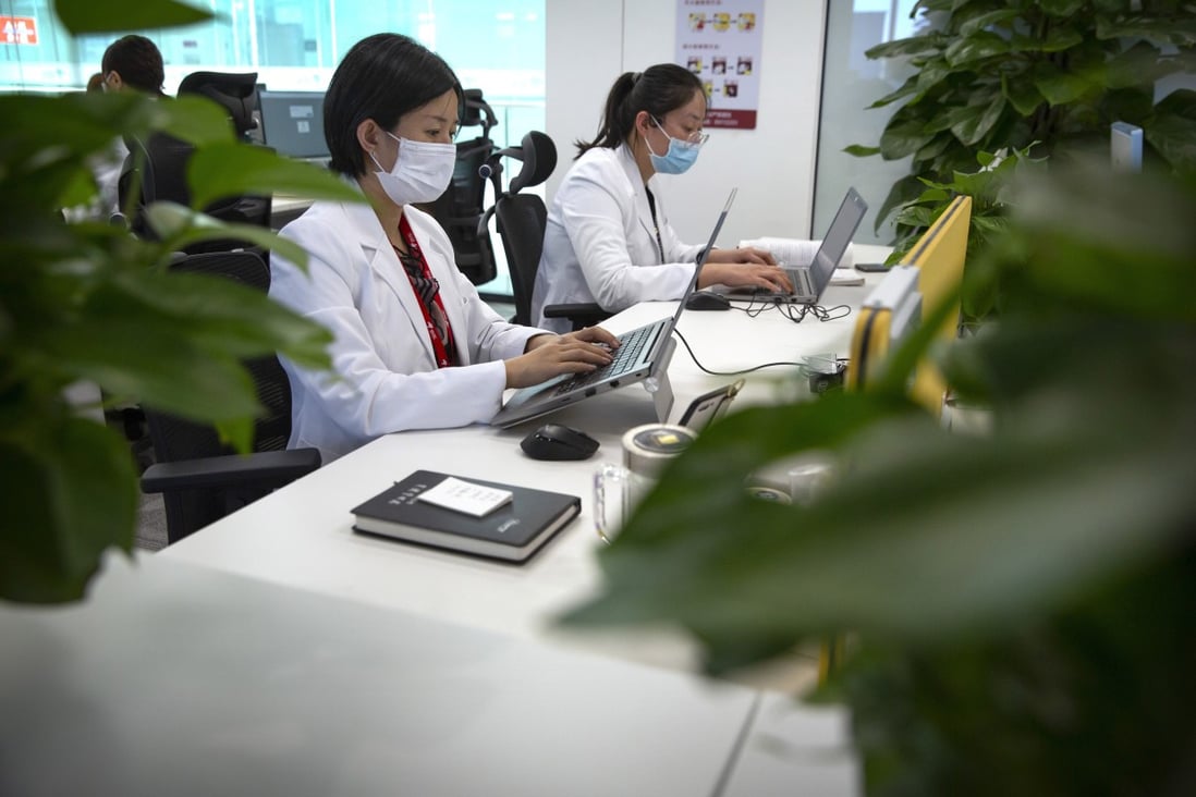 JD Health doctors use computers to chat online as they consult with patients at the JD.com headquarters in Beijing on Friday, March 27, 2020. Photo: AP
