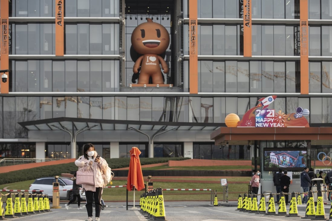 An employee exits the campus of Alibaba Group Holding’s headquarters in Hangzhou, in eastern China’s Zhejiang province, on January 20, 2021. Photo: Bloomberg