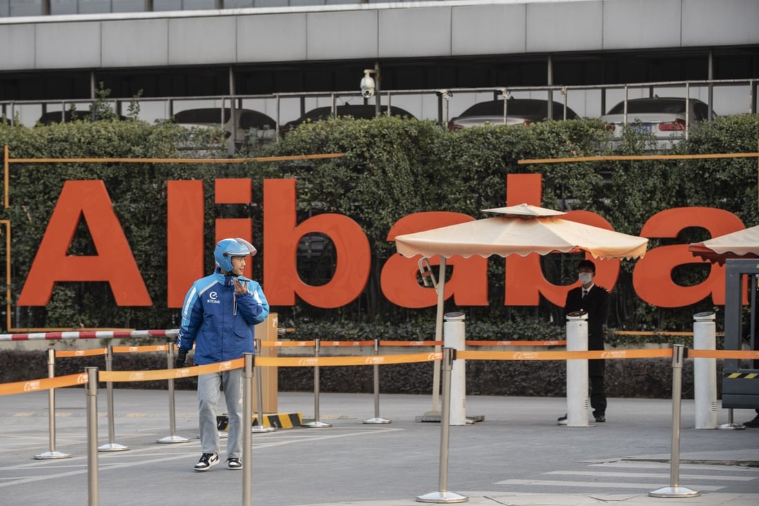 A food delivery worker exits the campus of the Alibaba headquarters in Hangzhou, China. Photo: Bloomberg