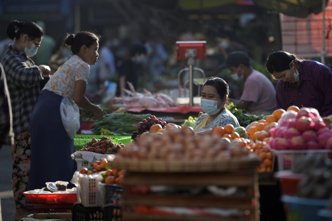 People are seen at a market in Yangon on February 2, 2021. Photo: Reuters
