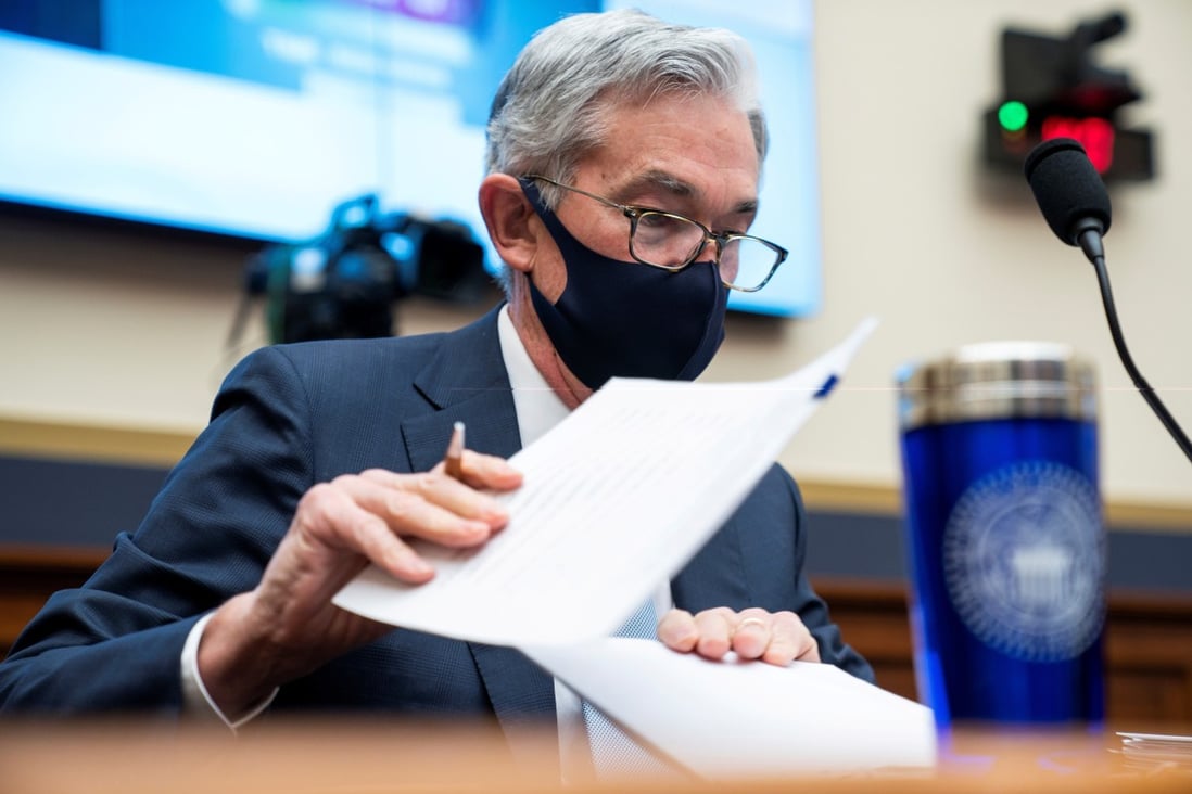 Federal Reserve chair Jerome Powell prepares for a House Financial Services Committee hearing in Washington on December 2 last year. The Fed’s ultra-loose monetary policy settings remain the order of the day even though they may have undesired side-effects. Photo: Reuters
