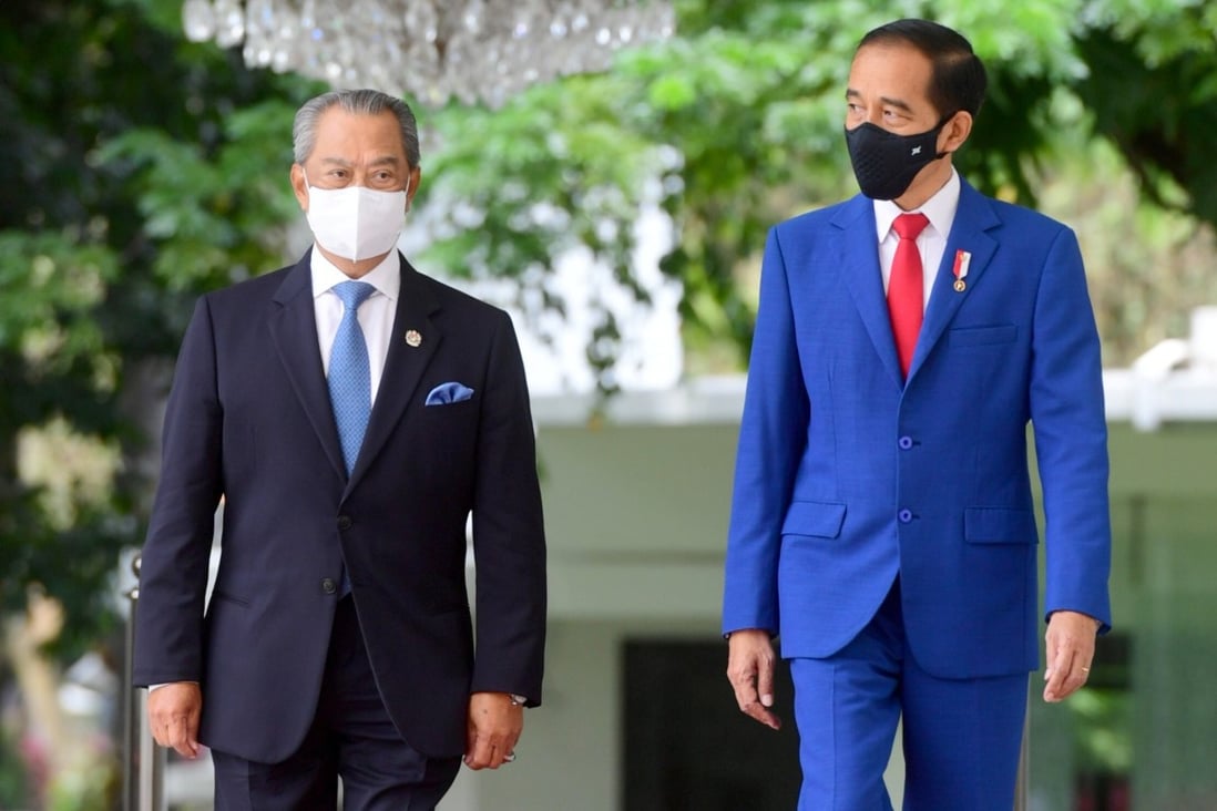 Malaysian PM Muhyiddin Yassin and Indonesian President Joko Widodo at the Presidential Palace in Jakarta on February 5, 2021. Photo: Indonesia's Presidential Palace via Reuters