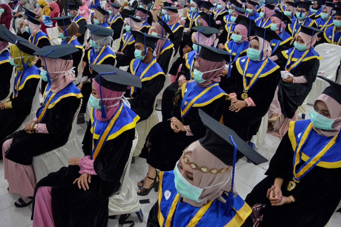 Students wearing face masks attend a graduation ceremony at a vocational school in Indonesia in September last year. Photo: AFP