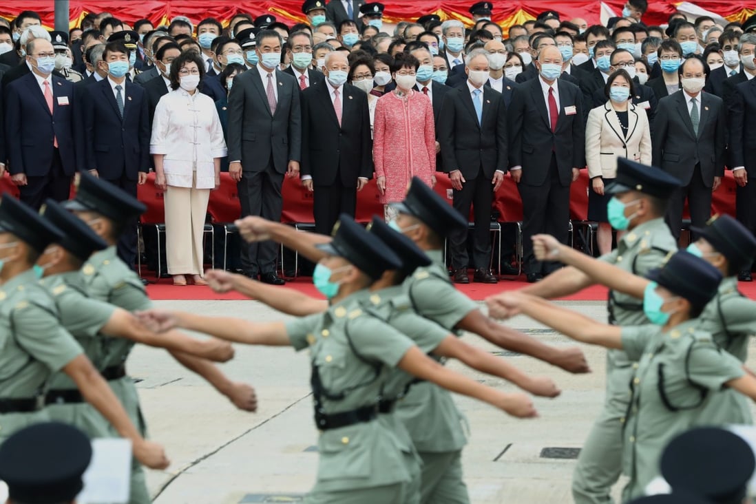 Chief Executive Carrie Lam (centre, in pink) and other top government officials attend the National Day flag-raising ceremony at Golden Bauhinia Square in Wan Chai on October 1 last year. In the wake of the 2014 Occupy protests, Lam’s election in 2017 failed to heal the rifts in society. Photo: Nora Tam