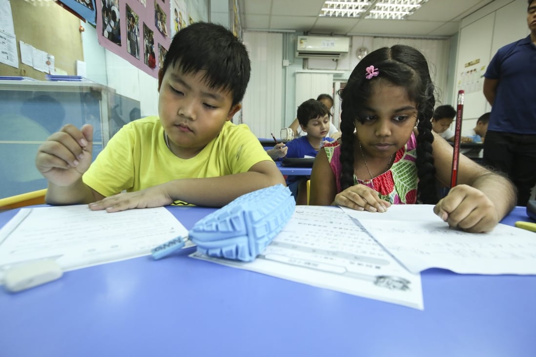 Children do their homework at Integrated Brilliant Education Centre, which provides academic support for Hong Kong’s underprivileged ethnic minority children, in Jordan in 2017. Photo: Edmond So