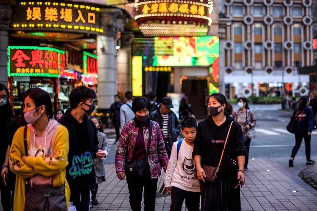 Pedestrians walk along a pavement in Macau on January 22, 2020. Macau residents tend to be less vocal about their dissatisfaction with the government than Hongkongers. Photo: AFP