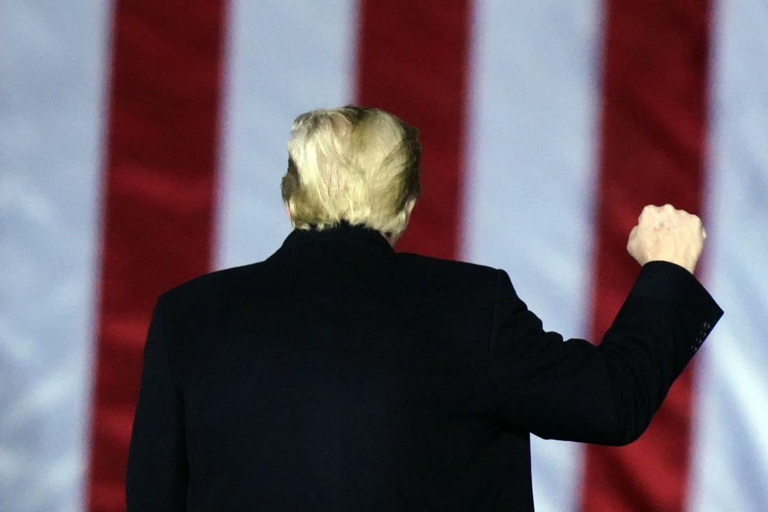 Then US President Donald Trump gestures at a campaign rally in Georgia in January. Photo: AP