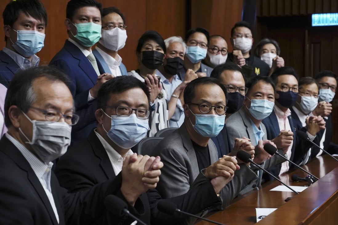 Hong Kong’s pro-democracy legislators pose for a picture before a press conference at Legco in Hong Kong on November 9, ahead of their mass resignation. Photo: AP