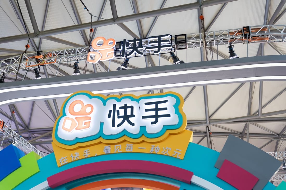 The name and logo of Kuaishou are seen at a booth at a gaming expo in Shanghai, China on August 2, 2019.